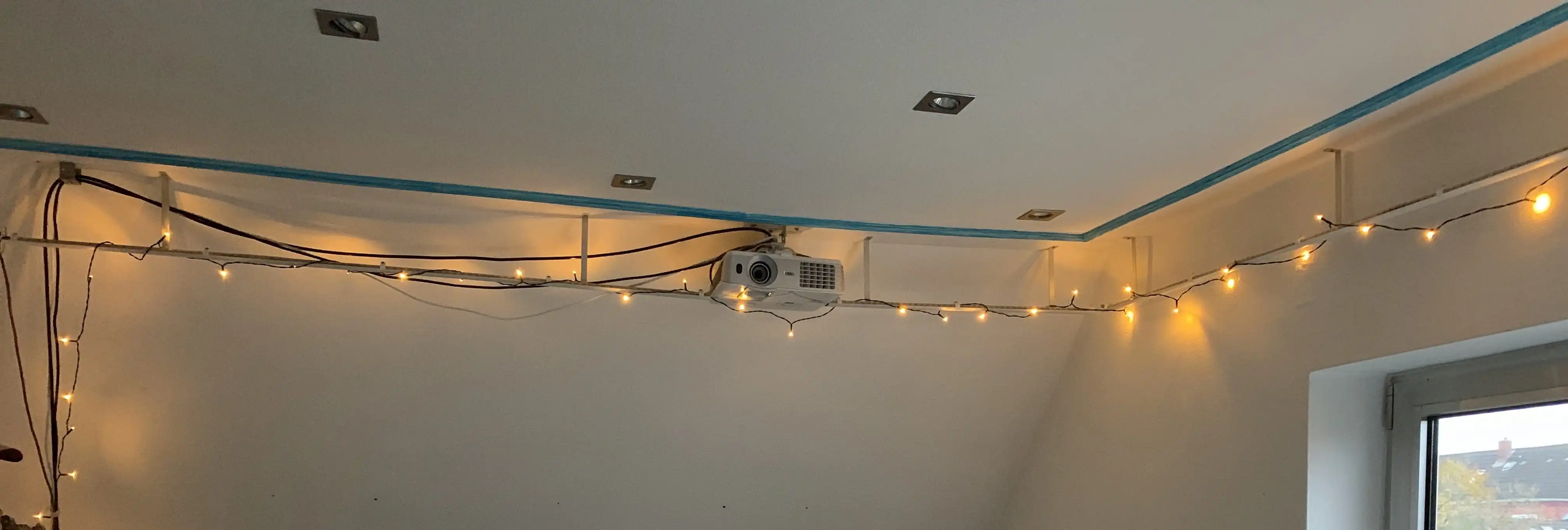 Suspended LED Strip wrapped in Christmas chain lights